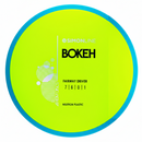 Axiom Neutron Simon Line Bokeh fairway driver disc, yellow disc with blue rim