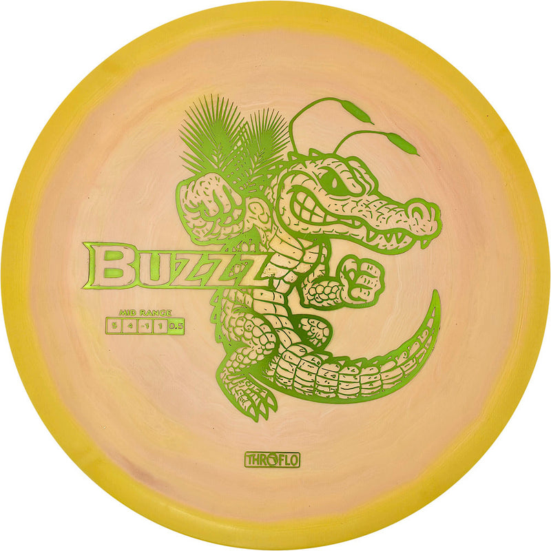 Discraft ESP Buzzz midrange disc, ThroFlo “Gator Buzzz” stamp, peach and yellow disc