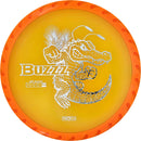 Discraft FuZed Buzzz midrange disc, ThroFlo “Gator Buzzz” stamp, orange disc with white rim