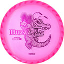 Discraft FuZed Buzzz midrange disc, ThroFlo “Gator Buzzz” stamp, pink disc with white rim