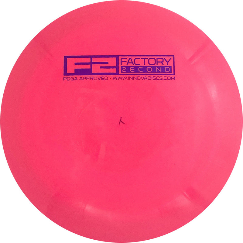 Innova Star Shryke driver disc, F2 Factory Second Bar Stamp stamp, pink disc